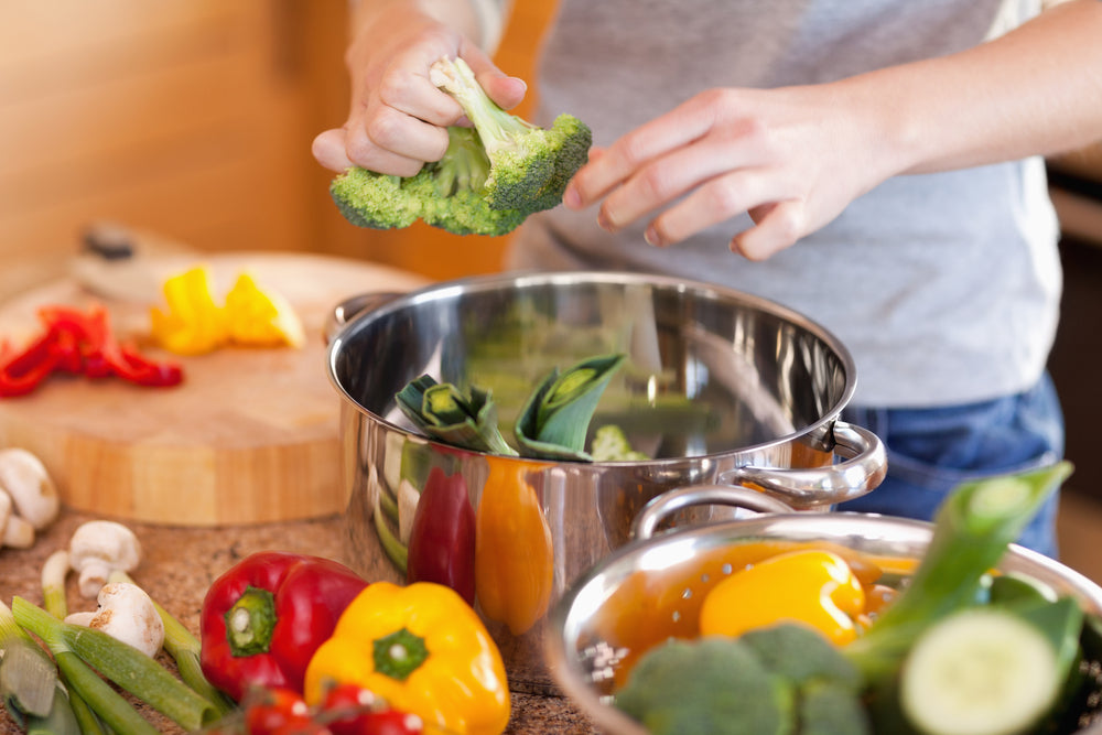 woman washing vegetables